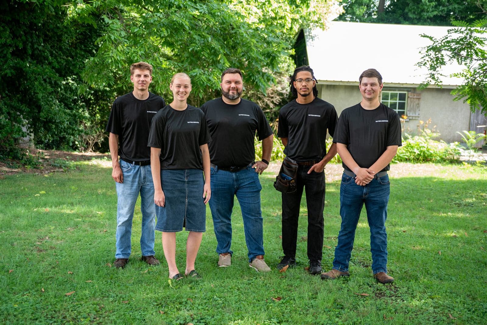 The RayTech Services team outdoors in matching shirts